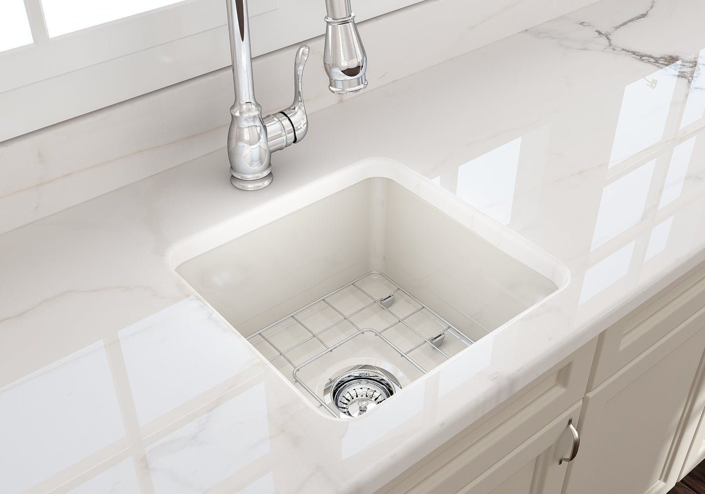 Close-up of BOCCHI SOTTO 18" Fireclay Modern Undermount Single Bowl Kitchen Sink with Protective Bottom Grid and Strainer in Biscuit color.