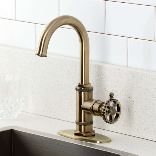 Kingston Brass KSD8503CG Fuller Single-Handle Bar Faucet, Antique Brass on a countertop with a modern design.