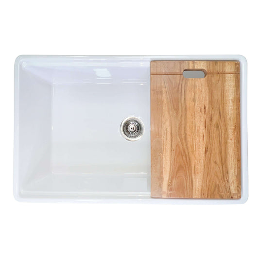 A 30-inch Nantucket single bowl workstation fireclay sink with a white interior and a wood cutting board on the right side.