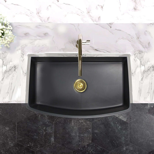 Nantucket Sinks 33" Farmhouse Fireclay Sink with Curved Apron - FCFS3320CA-MB displayed on elegant marble countertop.