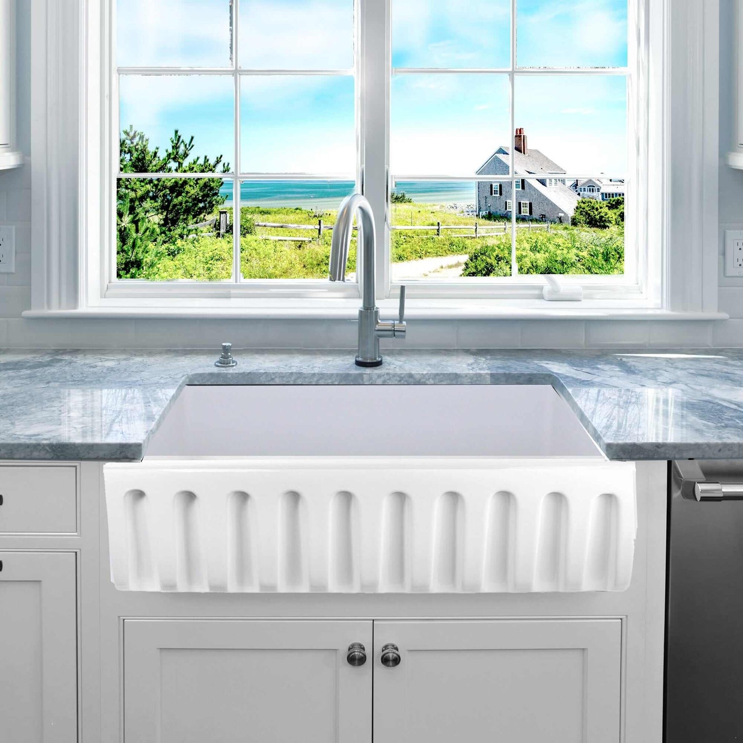 Nantucket 36" Reversible Italian Fireclay Farmhouse Sink - ISFCW36x18SO featured in a modern kitchen with scenic view.