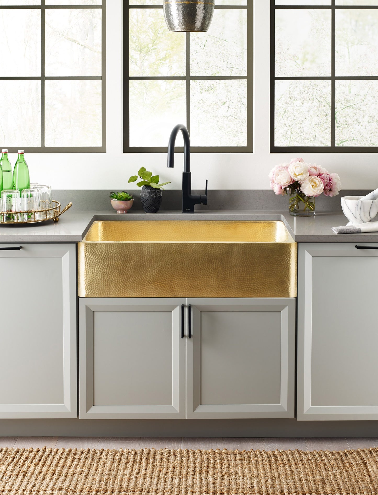 High res - Thompson Quiroga 33" Hammered Semi-Satin Brass Farmhouse Kitchen Sink - KSA-3322HPB installed in modern kitchen.