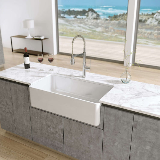 Front view of Latoscana 36" Reversible Fireclay Single Bowl Farmhouse Sink in a modern kitchen setting.