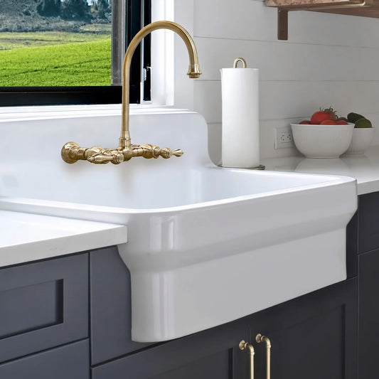 WHITEHAUS 30" Old Fashioned Country Fireclay Utility Sink with High Backsplash OFCH2230 in a kitchen setting.