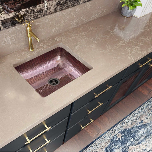 Nantucket Sinks 17" Hammered Copper Rectangle Bar Sink - REHC-2.5 installed in a stylish kitchen countertop.