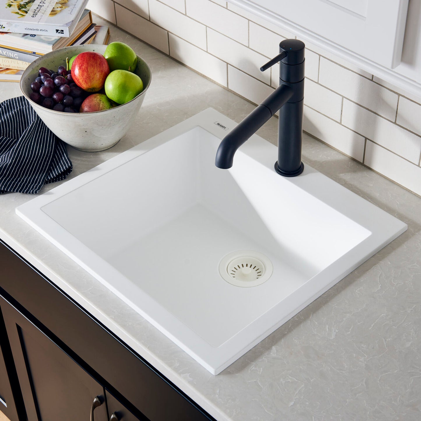 Ruvati epiGranite 22" Topmount Single Bowl Kitchen Sink RVG1022 in Arctic Matte White with modern faucet and fresh fruit.