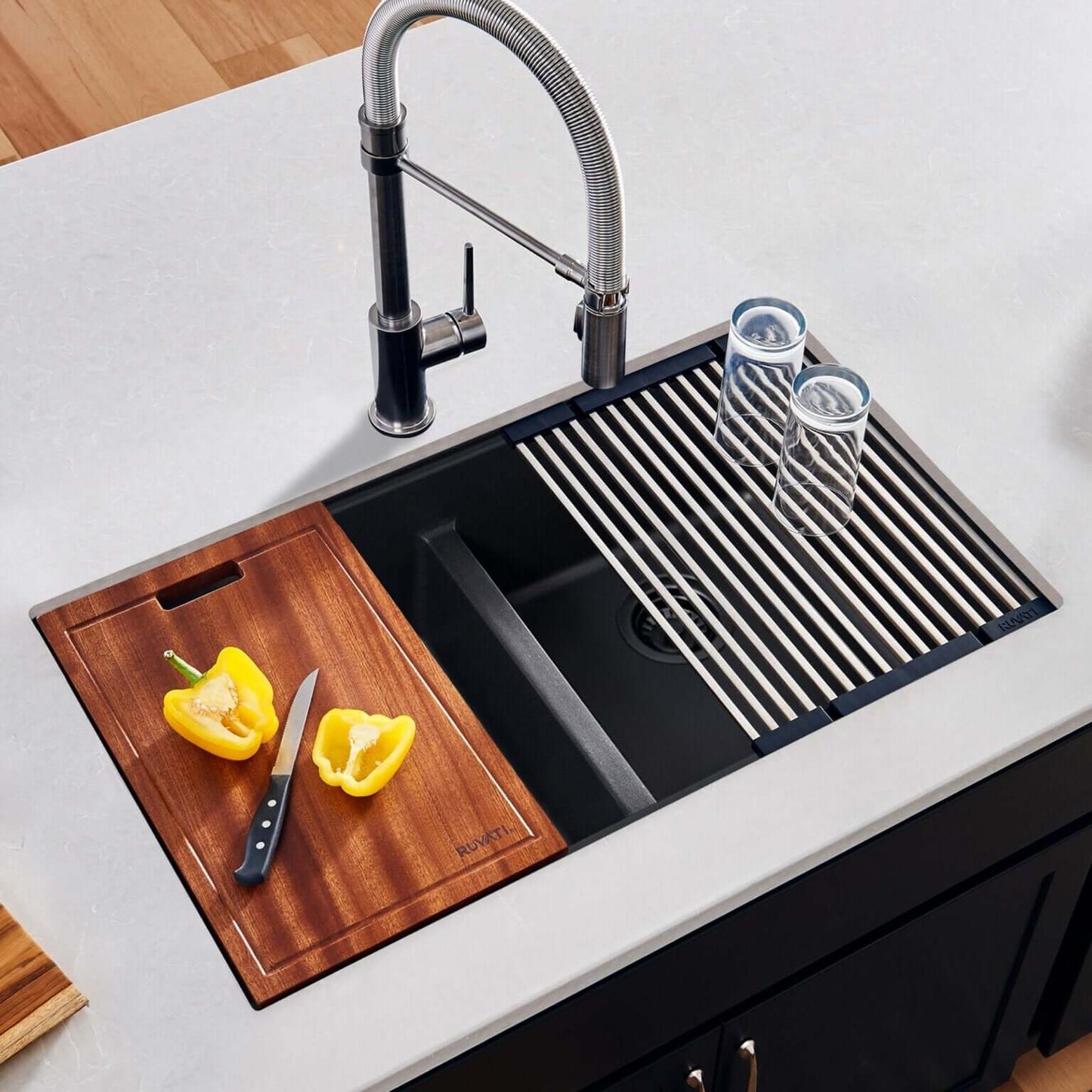 Ruvati RVG2343 32" Granite Composite Undermount Workstation Sink with cutting board and drying rack.