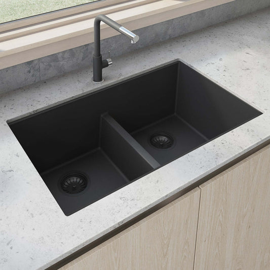 Ruvati RVG2385 33" Granite Composite Undermount Low Divide Sink in modern kitchen countertop setting.