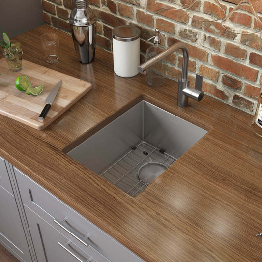 Ruvati 10" Gravena Bar Prep Sink Undermount - RVH7010 installed in a modern kitchen countertop with wooden surface.