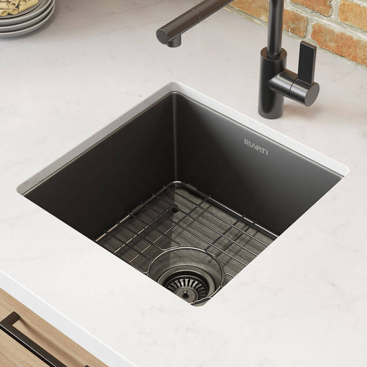 Ruvati 15" Terraza Nano-PVD Bar Prep Sink Undermount - RVH7015 shown in a modern kitchen with accessories.