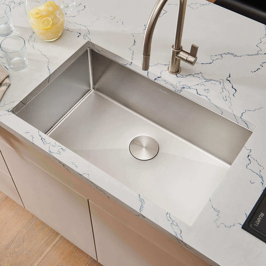 Ruvati 32" Gravena Single Bowl Undermount Kitchen Sink - RVH7400 installed in a modern kitchen countertop with marble design.