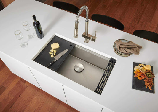 Ruvati 30" Roma Hex LedgeFit® Workstation Kitchen Sink - RVH8630 in modern kitchen with food preparations and wine.