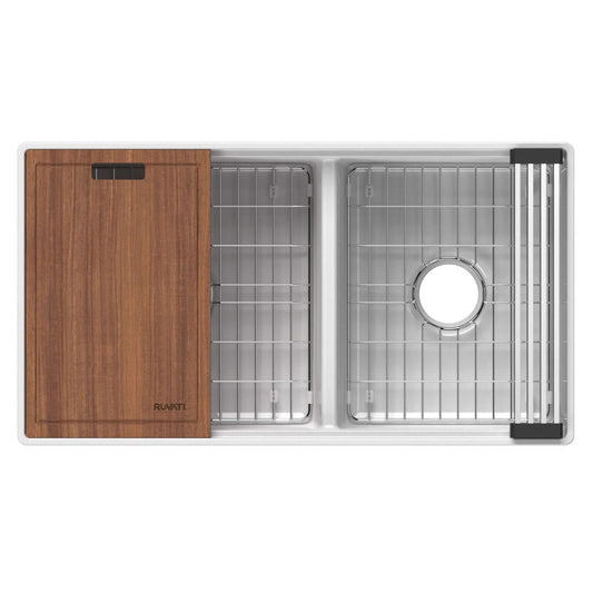 Ruvati 33" Fireclay Workstation Farmhouse Kitchen Sink Double Bowl White - RVL2382WH with wood cutting board and stainless steel grate.