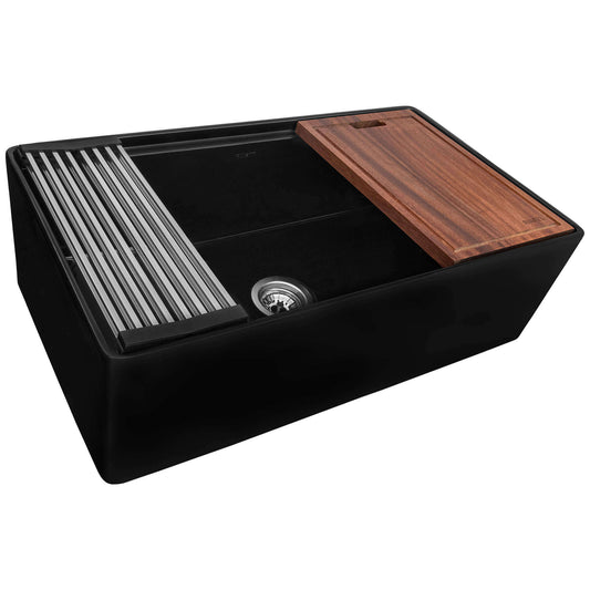 Top angle view of Ruvati 33" Fireclay Farmhouse Workstation sink in Black showing step-rim and accessories