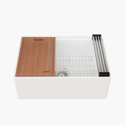 Ruvati 27" Fireclay Workstation Farmhouse Kitchen Sink White - RVL2781WH with wooden cutting board and grids.