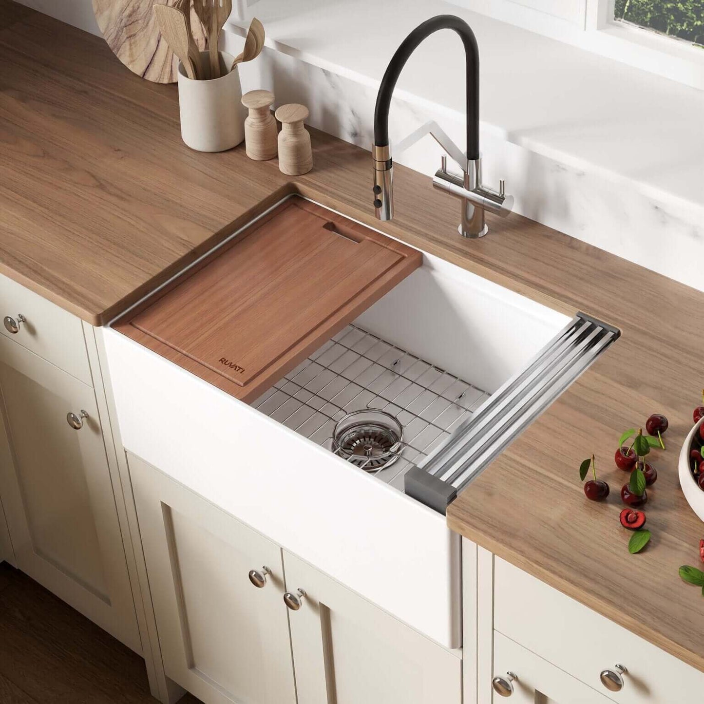 Ruvati 27" Fireclay Workstation Farmhouse Kitchen Sink White - RVL2781WH with a wood cutting board and modern faucet.