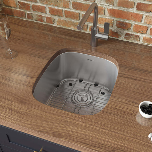 Ruvati 15" Undermount Bar Prep Sink Single Bowl - RVM4110 installed in a wooden countertop with modern faucet.