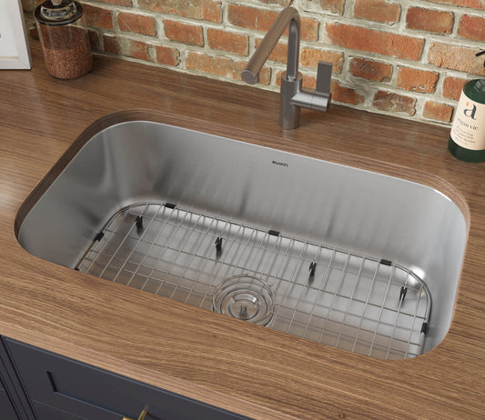 Ruvati 32" Undermount Kitchen Sink Single Bowl - RVM4200 spacious stainless steel sink with a grid in a modern kitchen setting.