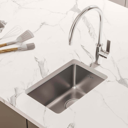Ruvati 15" Undermount Bar Prep Kitchen Sink Single Bowl - RVM5815 installed in a modern countertop with faucet.