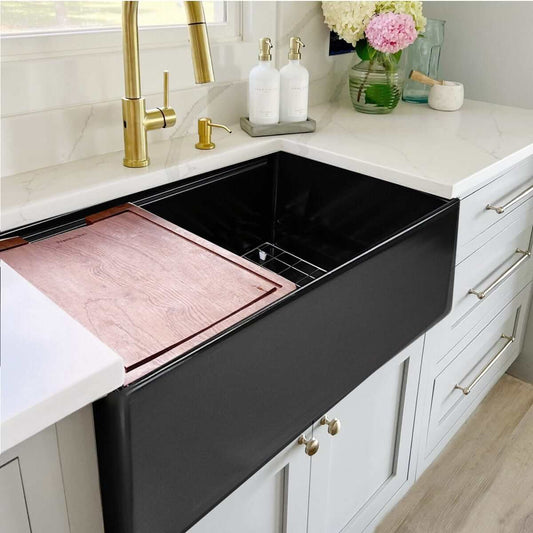 Nantucket 30" Workstation Fireclay Apron Sink Side Drain - T-PS30MB in matte black with wooden cutting board.