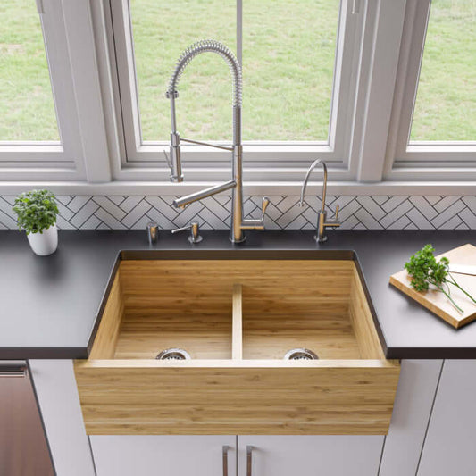 ALFI BRAND 33" Double Bowl Bamboo Farmhouse Sink - AB3321 displayed in a modern kitchen with stainless steel fixtures.