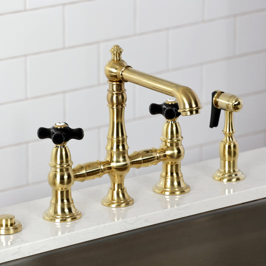Kingston KS7277PKXBS Duchess Bridge Kitchen Faucet with Brass Sprayer, Brushed Brass on a kitchen countertop.