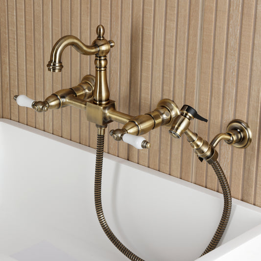 Kingston KS2443PLBS Heritage Two-Handle Wall Mount Bridge Kitchen Faucet with Brass Sprayer, Antique Brass