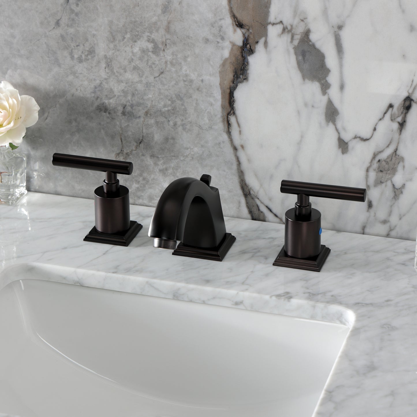 Kingston Brass FSC4688CML Manhattan Widespread Bathroom Faucet in a modern minimalist design on a marble countertop