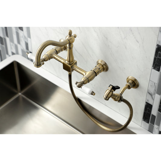 Kingston KS1263PLBS Heritage Two-Handle Wall Mount Bridge Kitchen Faucet with Brass Sprayer, Antique Brass