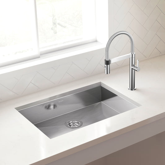 BLANCO Quatrus R0 25" Single Bowl Undermount ADA Stainless Steel Kitchen Sink with modern faucet in a white countertop.