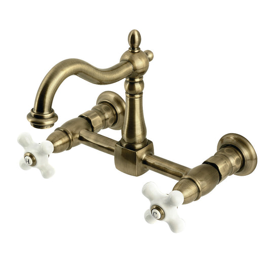 Kingston KS1263PX Heritage Two-Handle Wall Mount Bridge Kitchen Faucet, Antique Brass with white ceramic handles