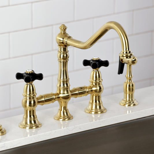 Kingston KS3277PKXBS Duchess Bridge Kitchen Faucet with Brass Sprayer, Brushed Brass on a kitchen countertop.