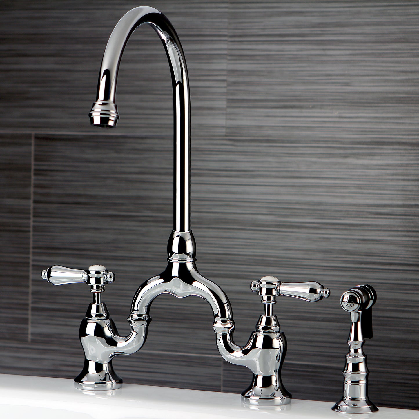 Kingston KS7793BALBS Heirloom Bridge Kitchen Faucet with Brass Sprayer, Antique Brass in a stylish kitchen setting