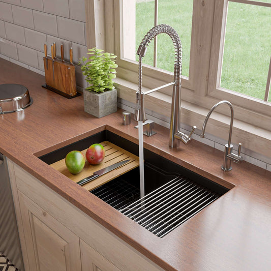 Alfi 32" Dual Mount Fireclay Workstation Kitchen Sink - ABFS3219SUD with bamboo cutting board and fresh apples.