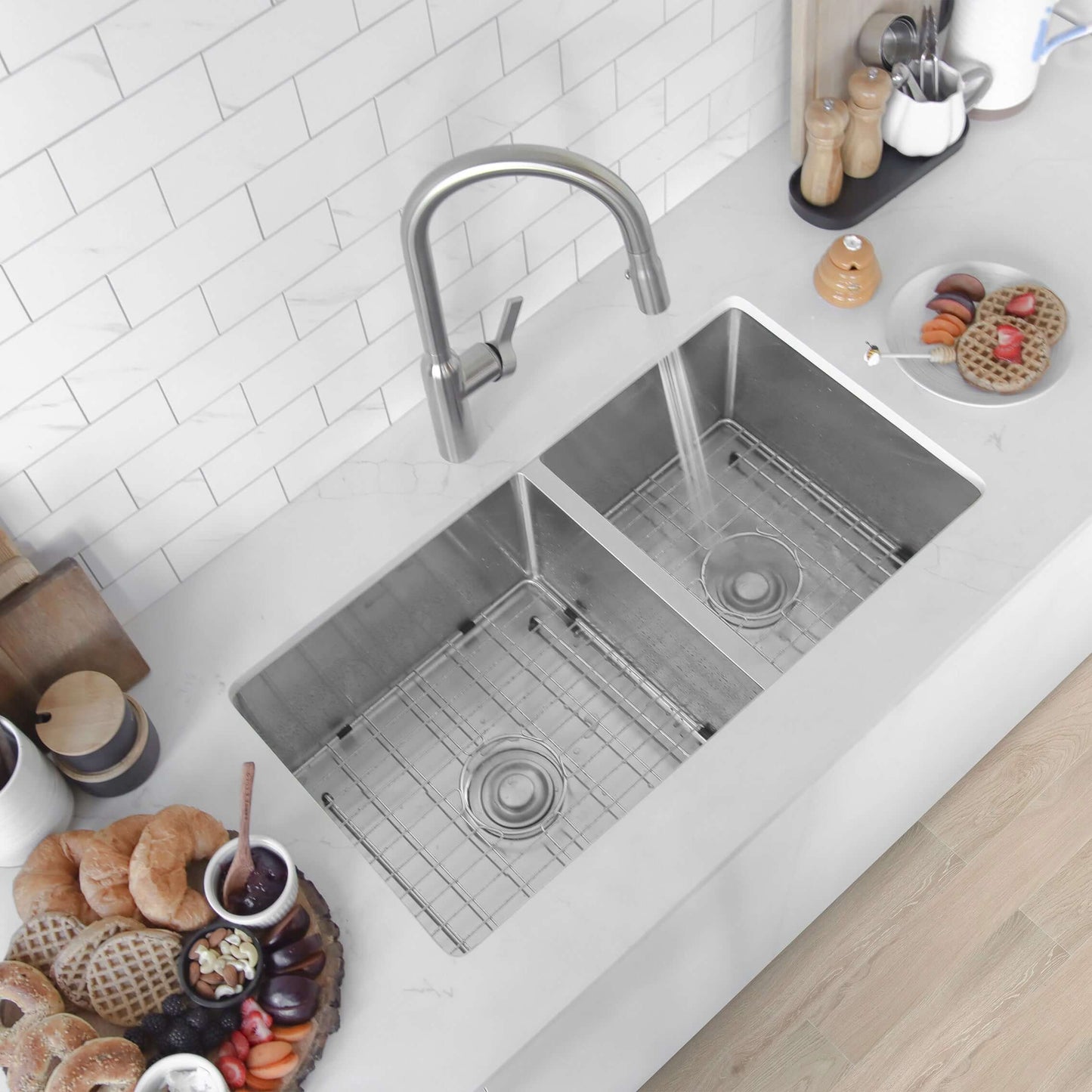 Stylish S-322XG 33" Undermount 60/40 Double Bowl Kitchen Sink viewed from above with water running and food items nearby.
