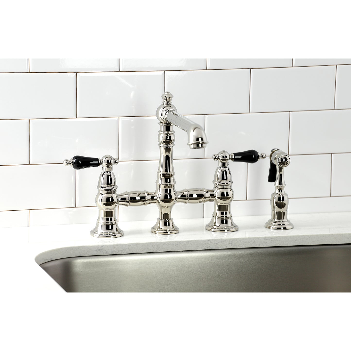 Kingston KS7277PKLBS Duchess Bridge Kitchen Faucet with Brass Sprayer, Brushed Brass in a kitchen setting.