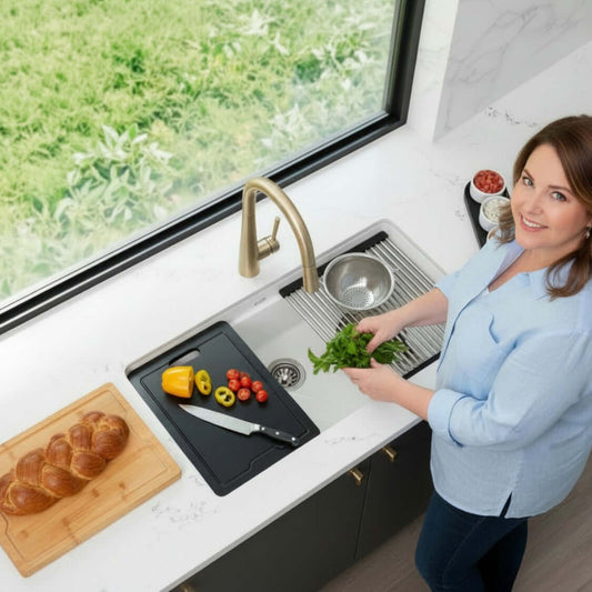 Stylish 32" Composite Granite Workstation Kitchen Sink with a woman preparing herbs and vegetables in a modern kitchen.