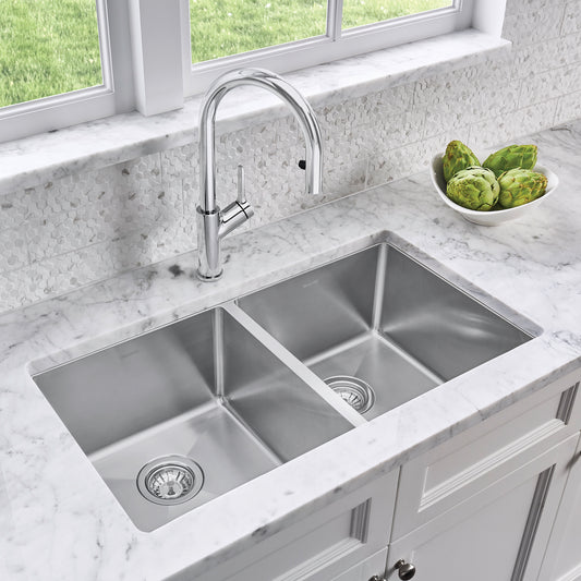 BLANCO Quatrus R15 32" 50/50 Double Bowl Undermount Stainless Steel Kitchen Sink with modern faucet and marble countertop.