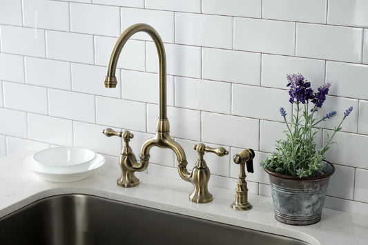 Kingston KS7793ALBS English Country Bridge Kitchen Faucet with Brass Sprayer, Antique Brass in a kitchen setting