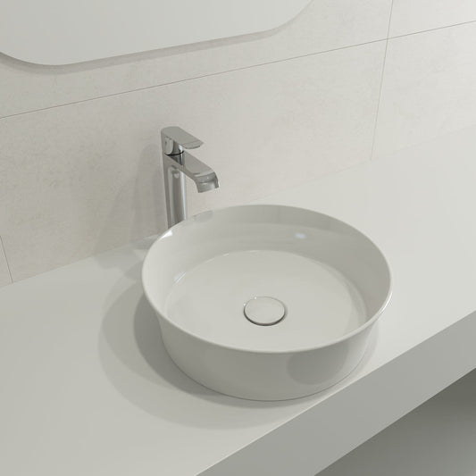 Close-up of BOCCHI SOTTILE 15" Round Vessel Fireclay with Matching Drain Cover in white on a sleek countertop.