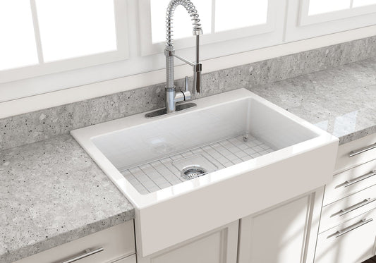 BOCCHI NUOVA Farmhouse Short Apron Front Fireclay 34" Single Bowl Kitchen Sink in white with modern faucet and gray countertop.
