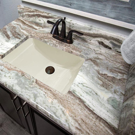 Nantucket 18" Undermount Ceramic Bathroom Sink UM-18x12-B on elegant granite countertop with faucet.