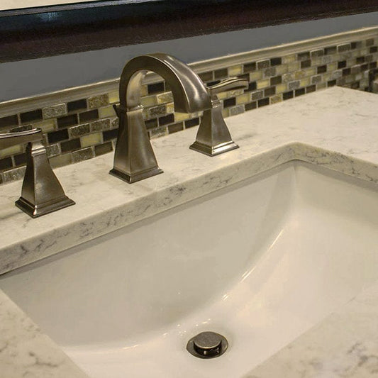 Nantucket 18" Undermount Ceramic Bathroom Sink UM-18x12-B installed in a marble countertop with modern faucet.