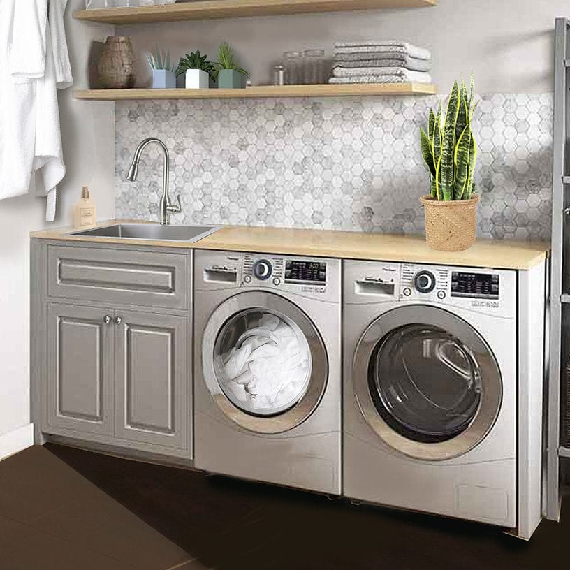 Stylish laundry room with stainless steel washer and dryer, modern sink, and wooden countertop.
