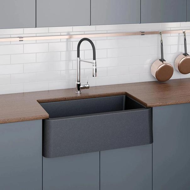 LaToscana Marmorin 33" Farmhouse Kitchen Sink in a modern kitchen, front view showcasing the apron design and countertop.