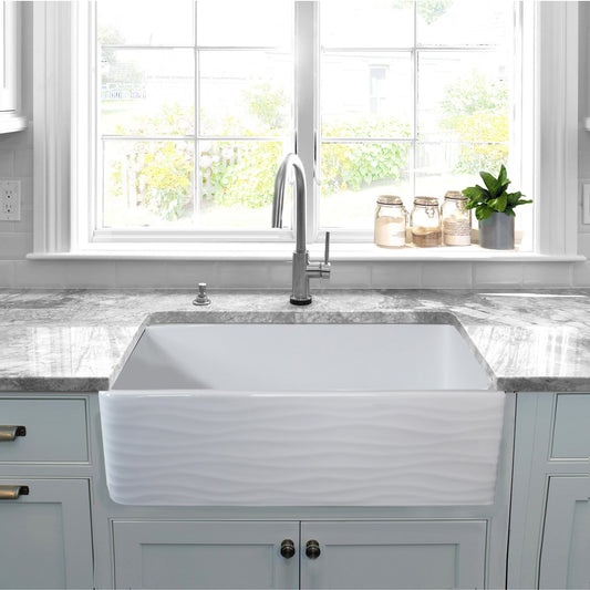 Nantucket 33" Fireclay Farmhouse with Waves - FCFS3320S-W-Waves front view in a modern kitchen setting.