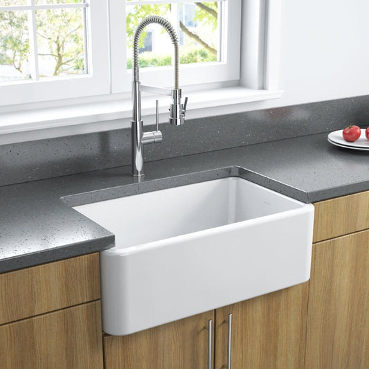 Latoscana 30" Reversible Fireclay Single Bowl Farmhouse Sink - LFS3018W front view in a modern kitchen setting