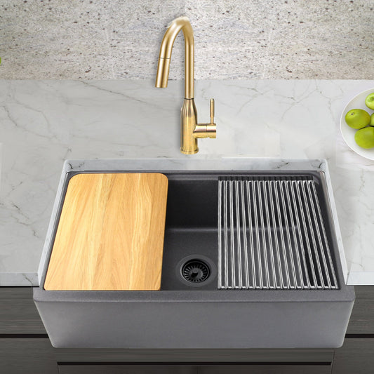Nantucket 33" Reversible Workstation Granite Composite Apron Sink with Accessory Pack - PR3320-APS-BL in a kitchen.