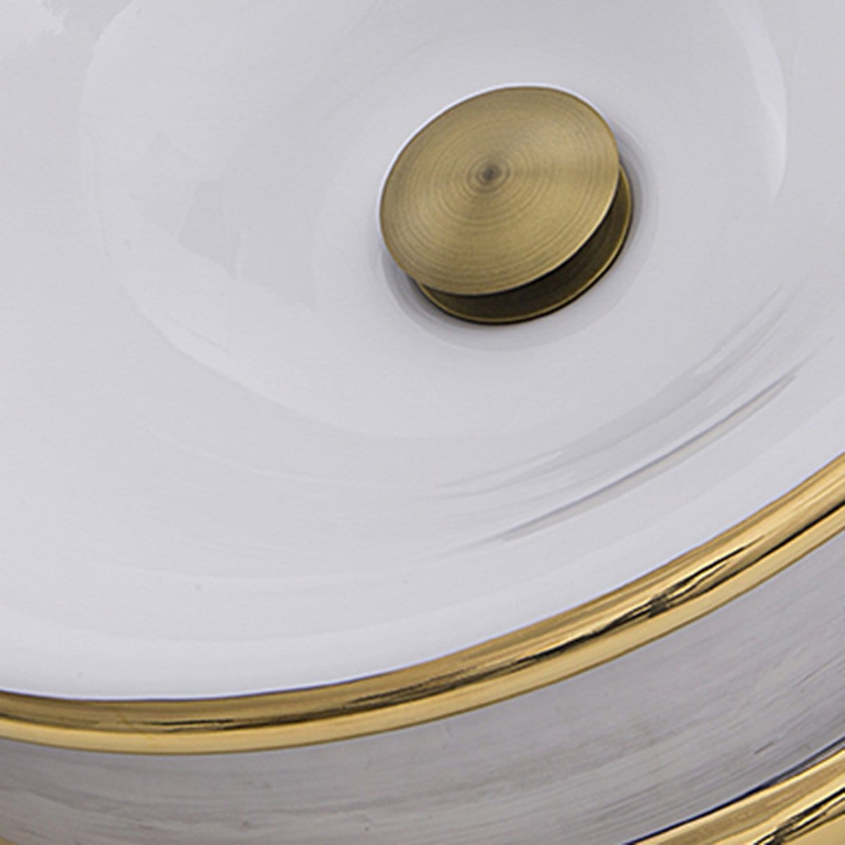 Nantucket St. Bart Fireclay Hand-decorated Vanity Sink - RC74040PG close-up showing brass drain and gold detailing.