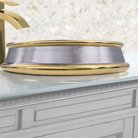 Nantucket St. Bart Fireclay Hand-decorated Vanity Sink - RC74040PG with golden rim displayed on a bathroom counter.